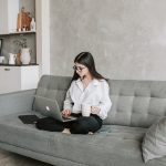 woman sitting on sofa while working at home 4050295 150x150.jpg
